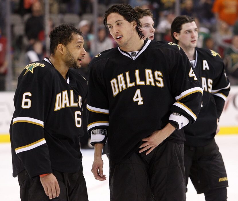 Dallas Stars defenseman Brenden Dillon (4) and defenseman Trevor Daley (6) skate after the...