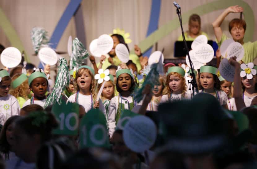 Lower school students (pre-k through 4th graders) sing altogether during Hockaday's...