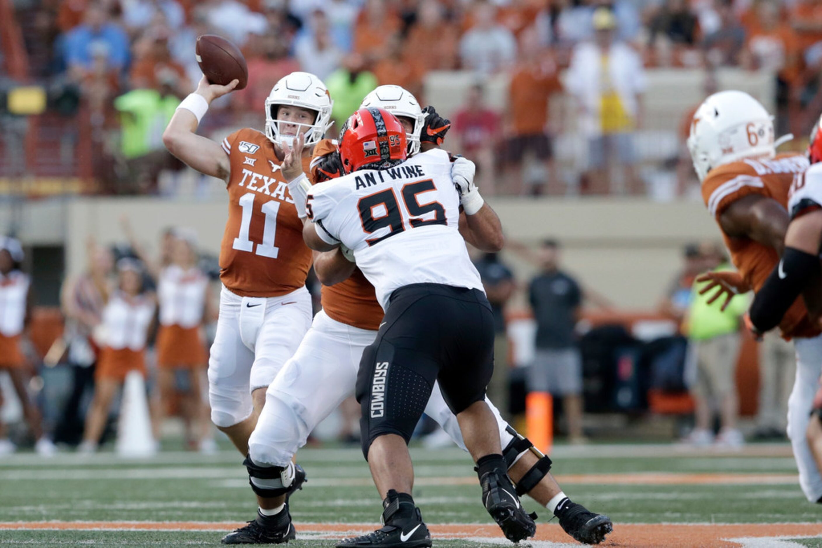 AUSTIN, TX - SEPTEMBER 21:  Sam Ehlinger #11 of the Texas Longhorns throws a pass in the...