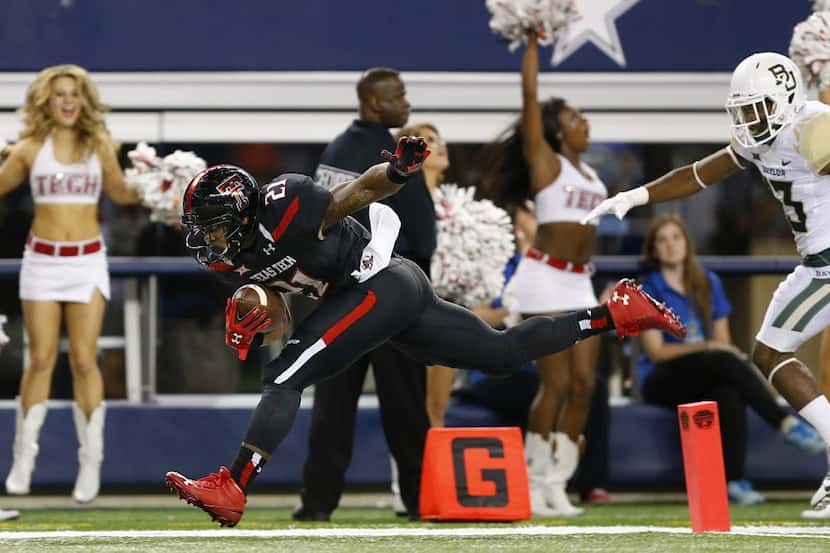 Texas Tech Red Raiders running back DeAndre Washington (21) is pushed into the end zone by a...