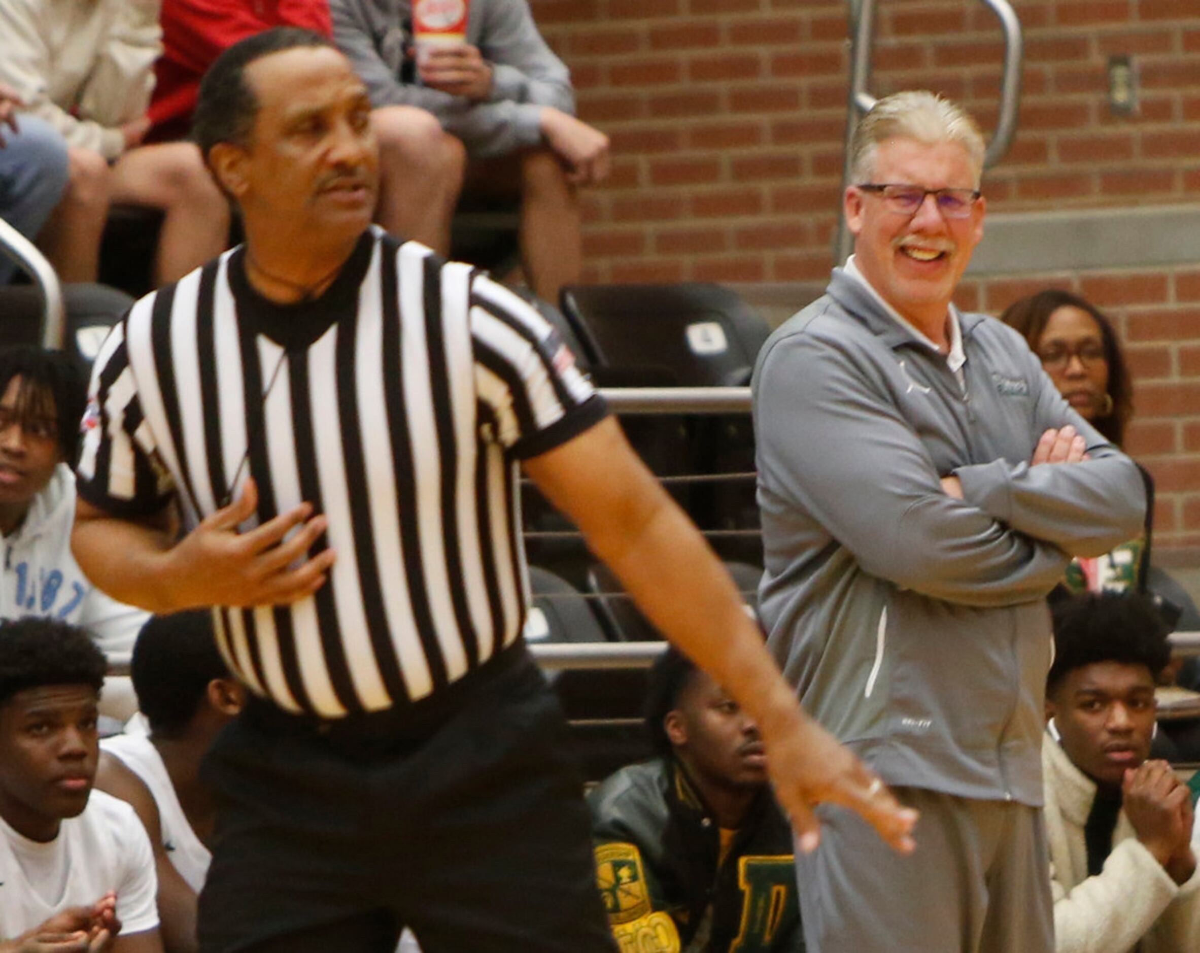 DeSoto head coach Chris Dyer reacts following the lack of a called foul during first half...
