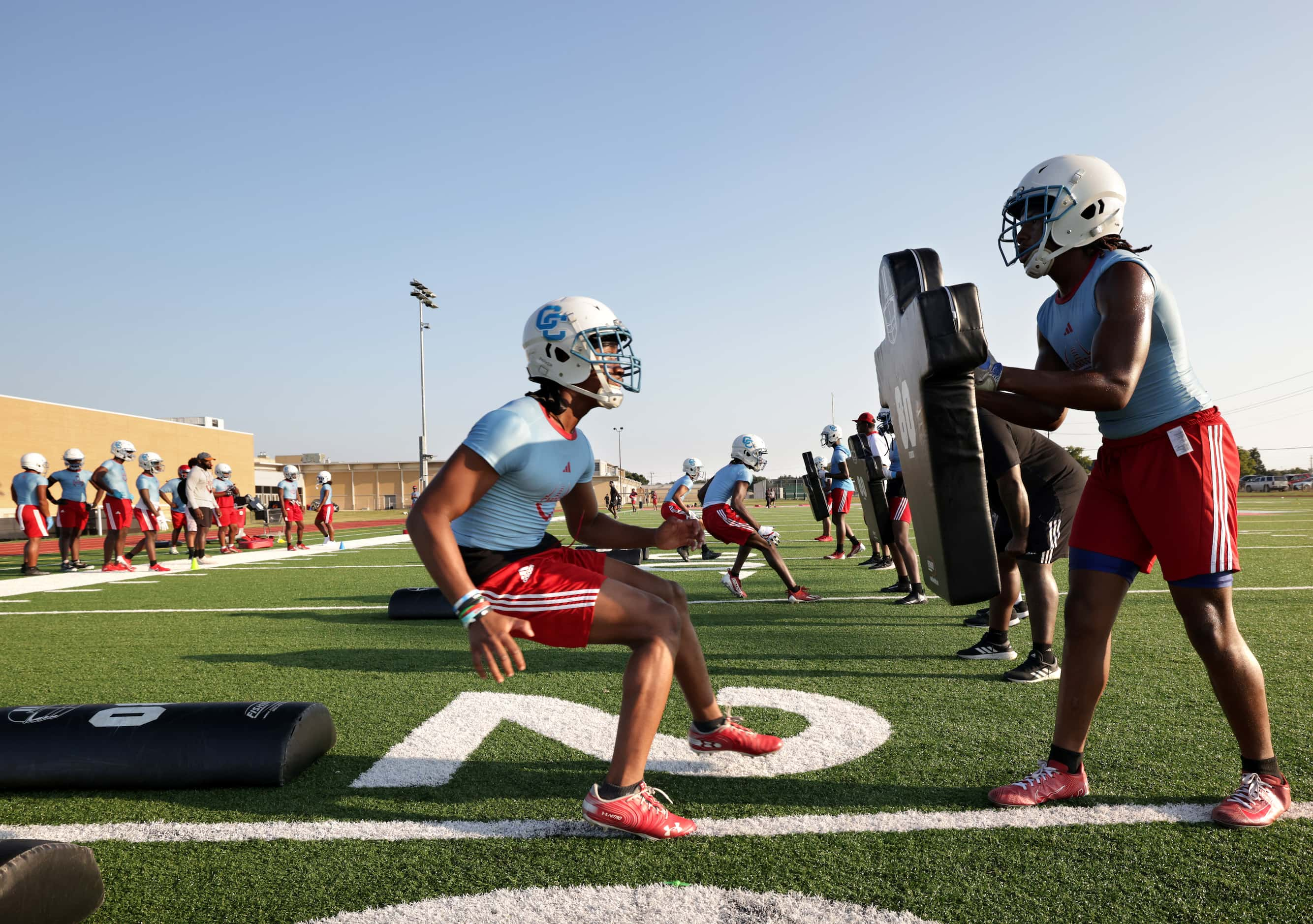 Players attend their first day of football practice at Carter High School in Dallas, TX, on...