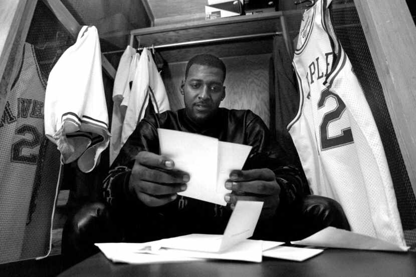 Dallas Maverick Roy Tarpley  goes through his mail and looks at some of his 2 year old ...