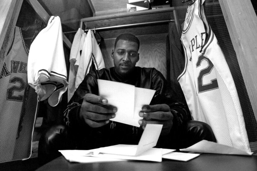 Dallas Maverick Roy Tarpley  goes through his mail and looks at some of his 2 year old ...