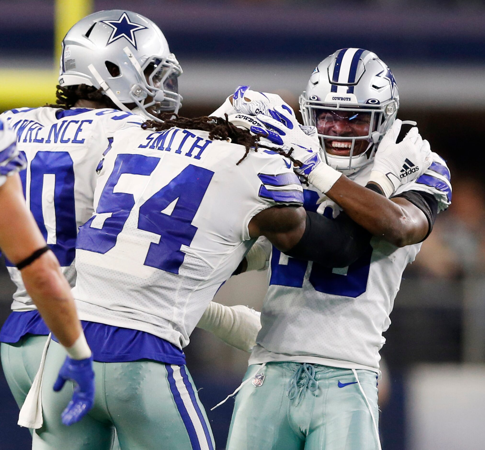 Dallas Cowboys middle linebacker Jaylon Smith (54) congratulates Dallas Cowboys free safety...