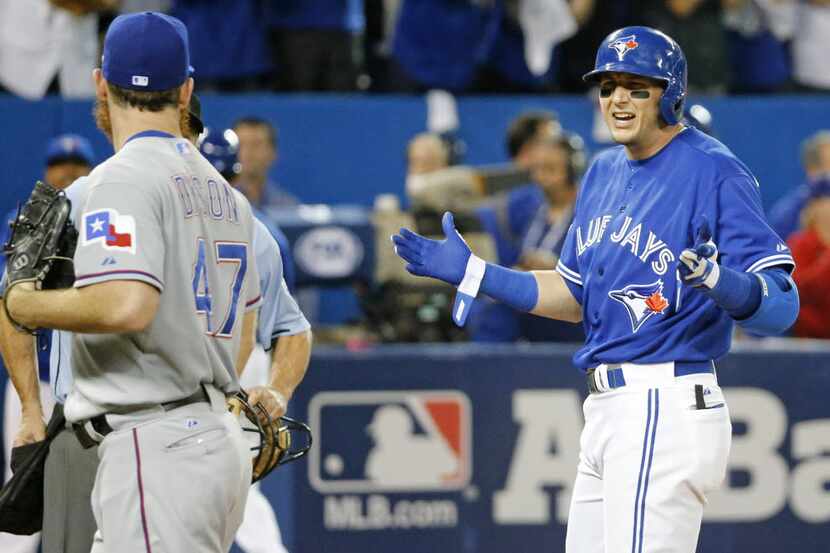 Texas Rangers relief pitcher Sam Dyson (47) has words with Toronto Blue Jays shortstop Troy...