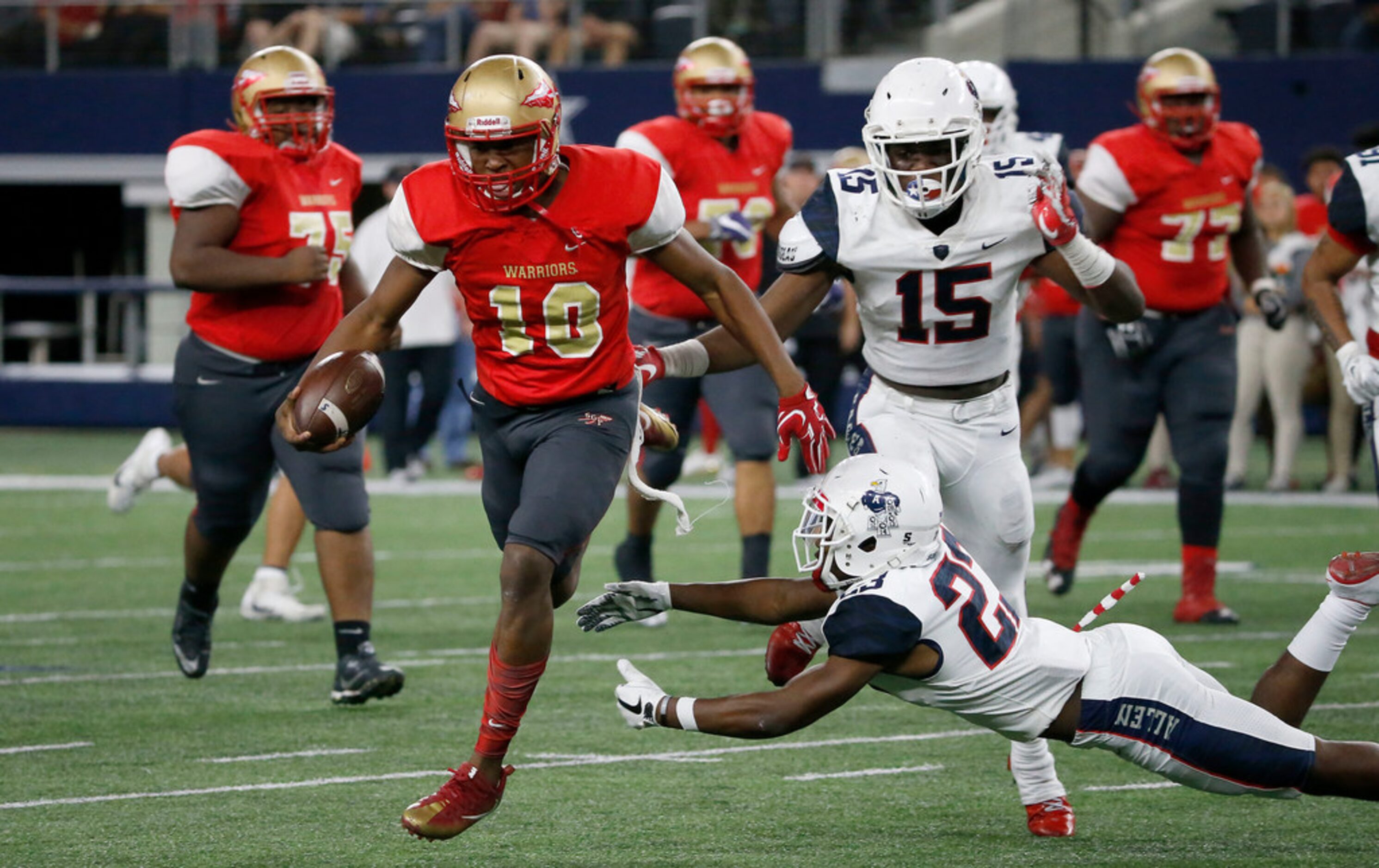 South Grand Prairie quarterback Nakia Brown (10) res away from a tackle by Allen's Mo...