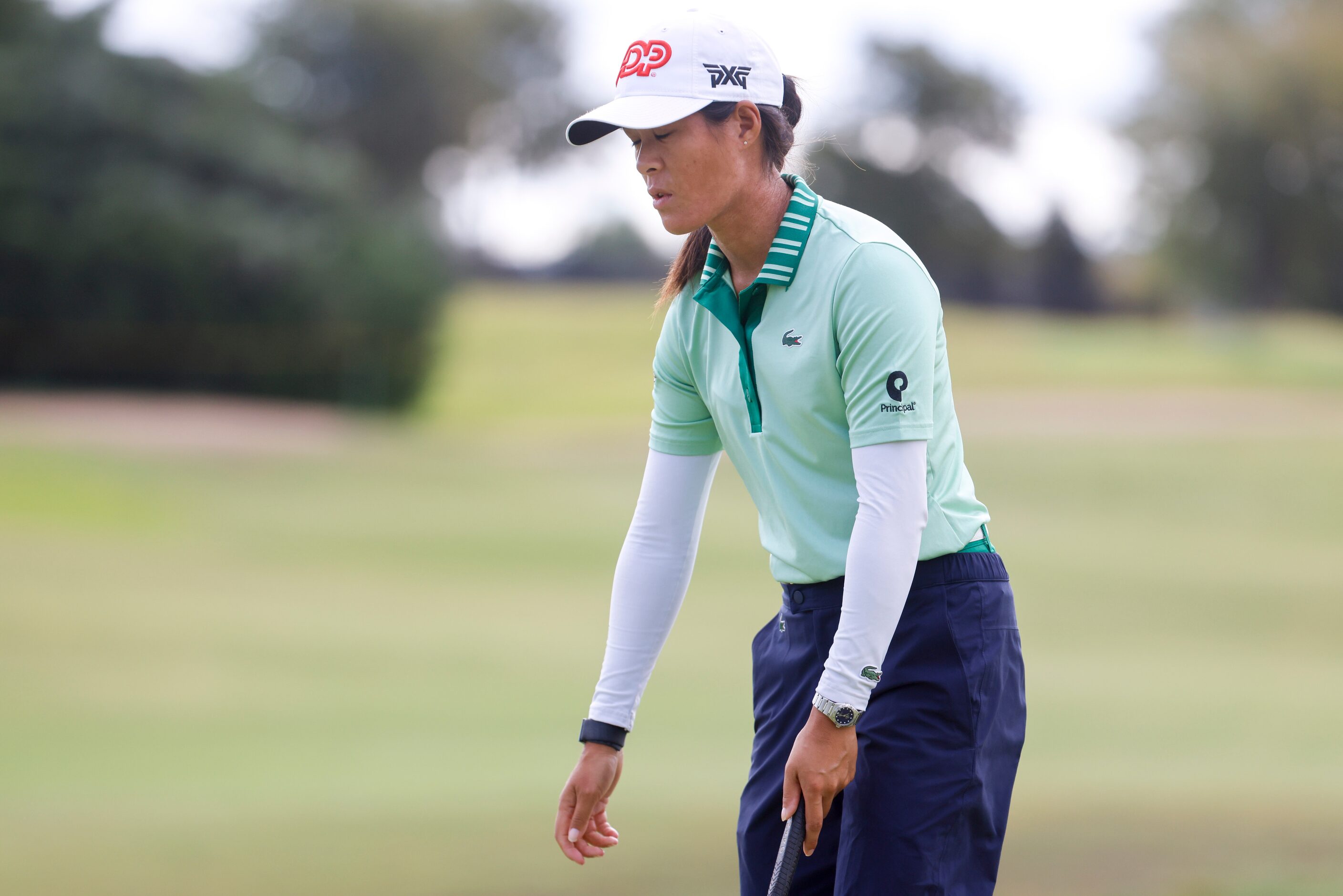 Celine Boutier of France reacts after missing the hole on the seventh green during the first...