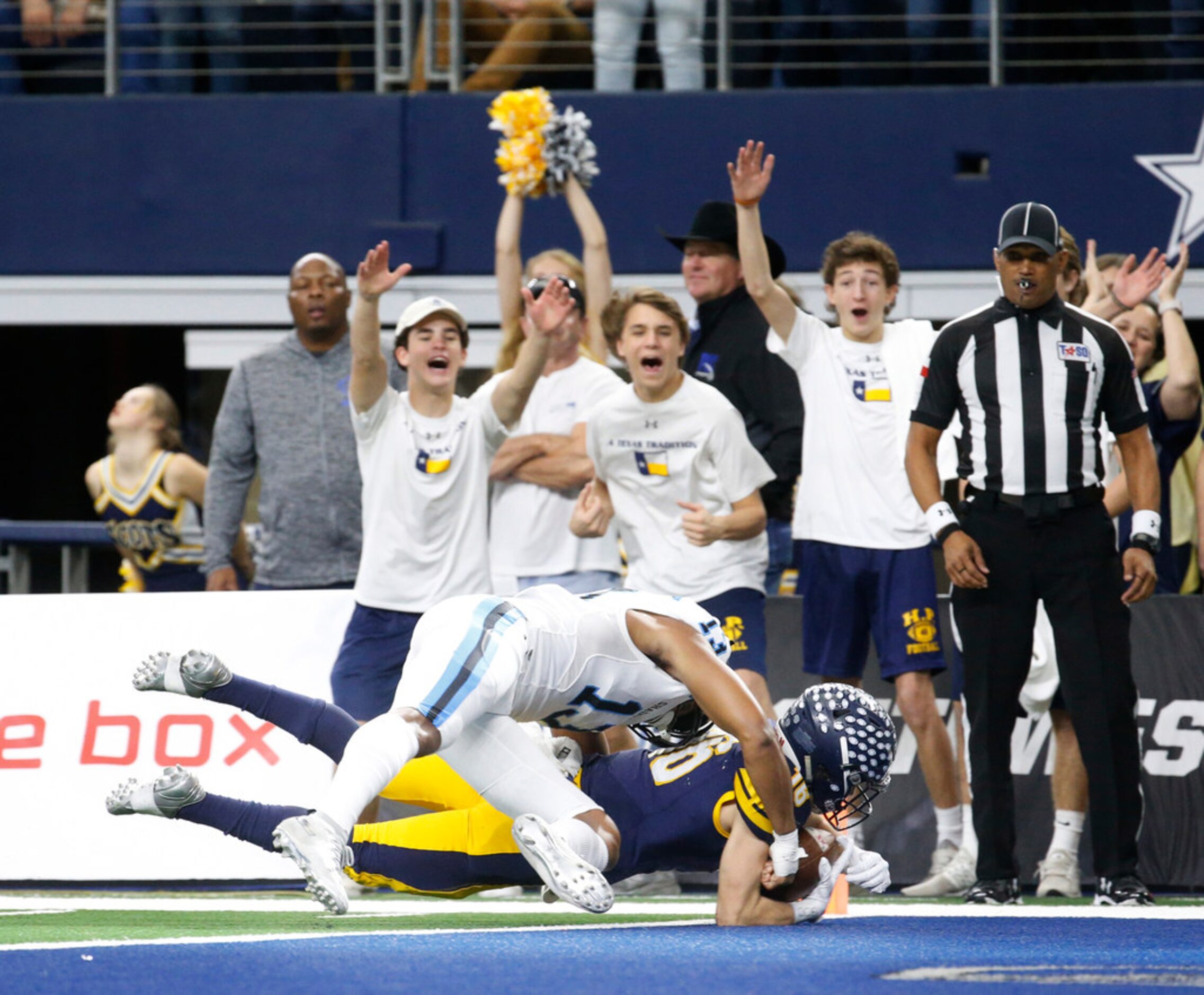 Highland Park's Finn Corwin (16) dives into the end zone for a touchdown as Shadow Creek's...