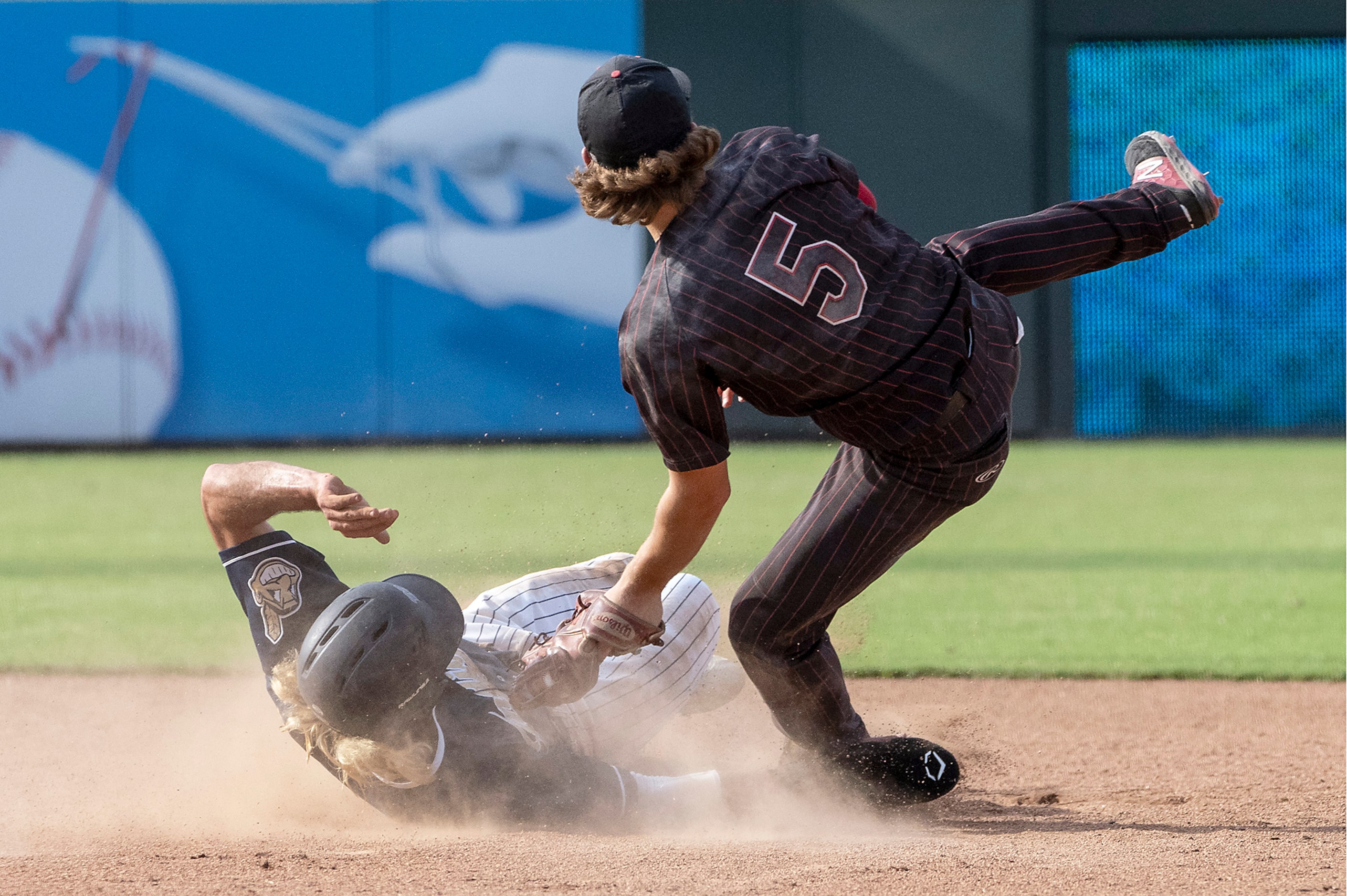 Rockwall-Heath Karson Krowka, (5), tags out Keller Gray Rowlett, (21), as they collide at...