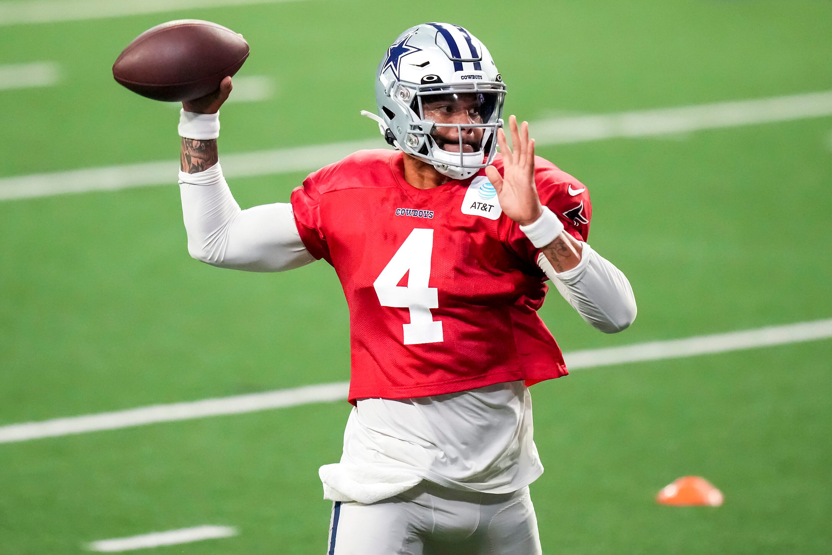 Dallas Cowboys quarterback Dak Prescott throws a pass during a training camp practice at The...