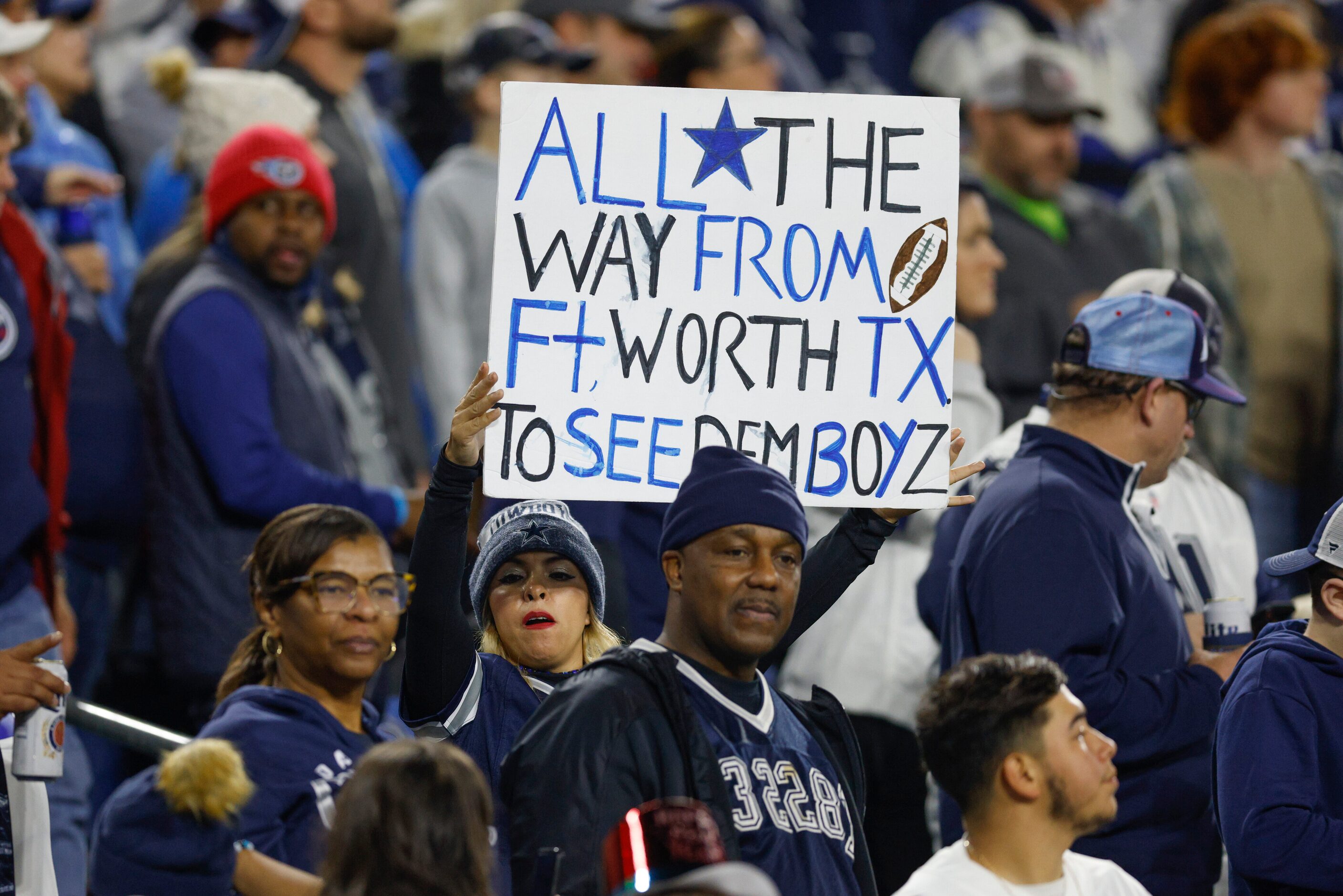 A Dallas Cowboys fan raises a sign during the first half of an NFL game at Nissan Stadium in...