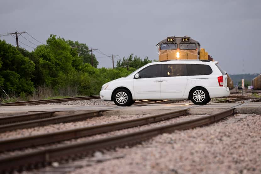 A driver went through the railroad intersection at Jefferson St. and SE 14th St. in Grand...