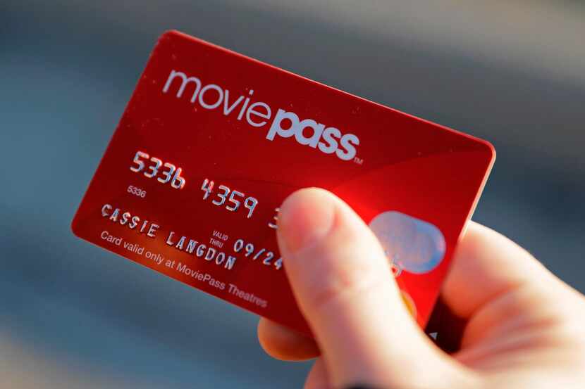 FILE - In this Jan. 30, 2018, file photo, Cassie Langdon holds her MoviePass card outside...