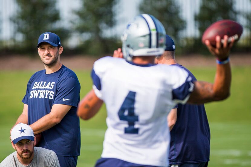 Dallas Cowboys quarterback Tony Romo watches quarterback Dak Prescott (4) on the field...