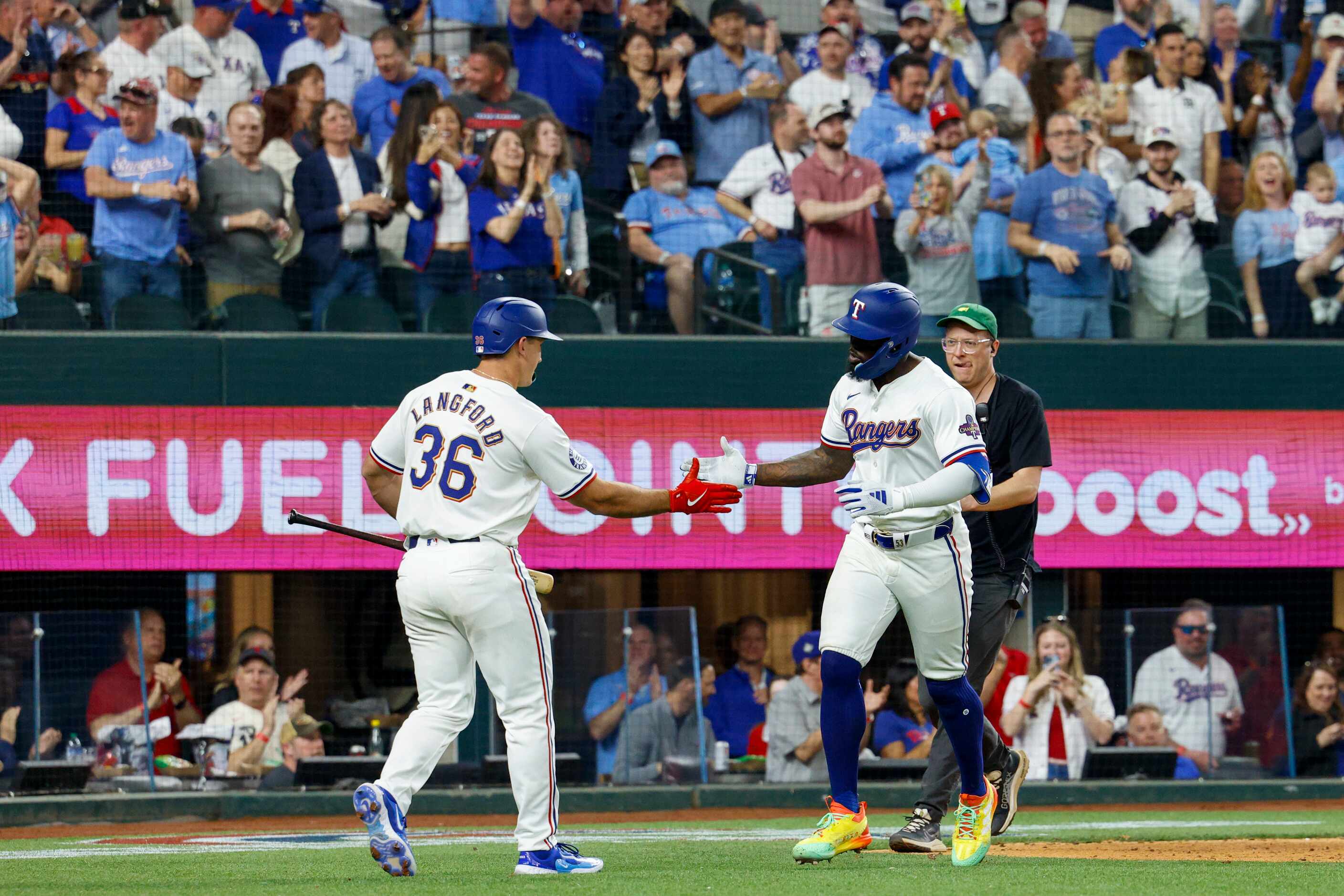 Texas Rangers right fielder Adolis Garcia (53) celebrates his home run with designated...