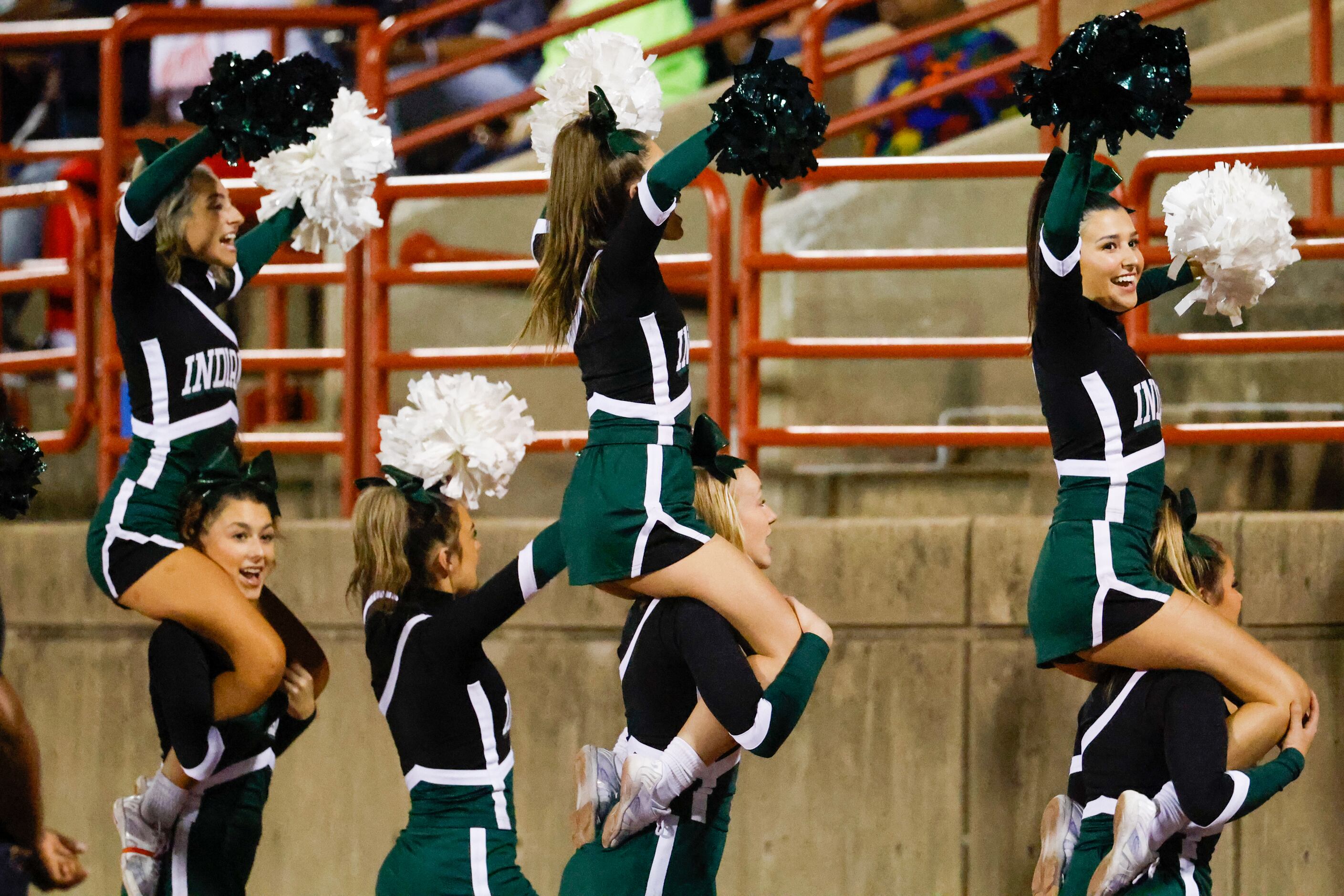 Waxahachie cheerleaders lead the crowd in a chant as the team plays Duncanville at Panther...