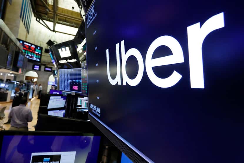The logo for Uber appeared above a trading post on the floor of the New York Stock Exchange,...