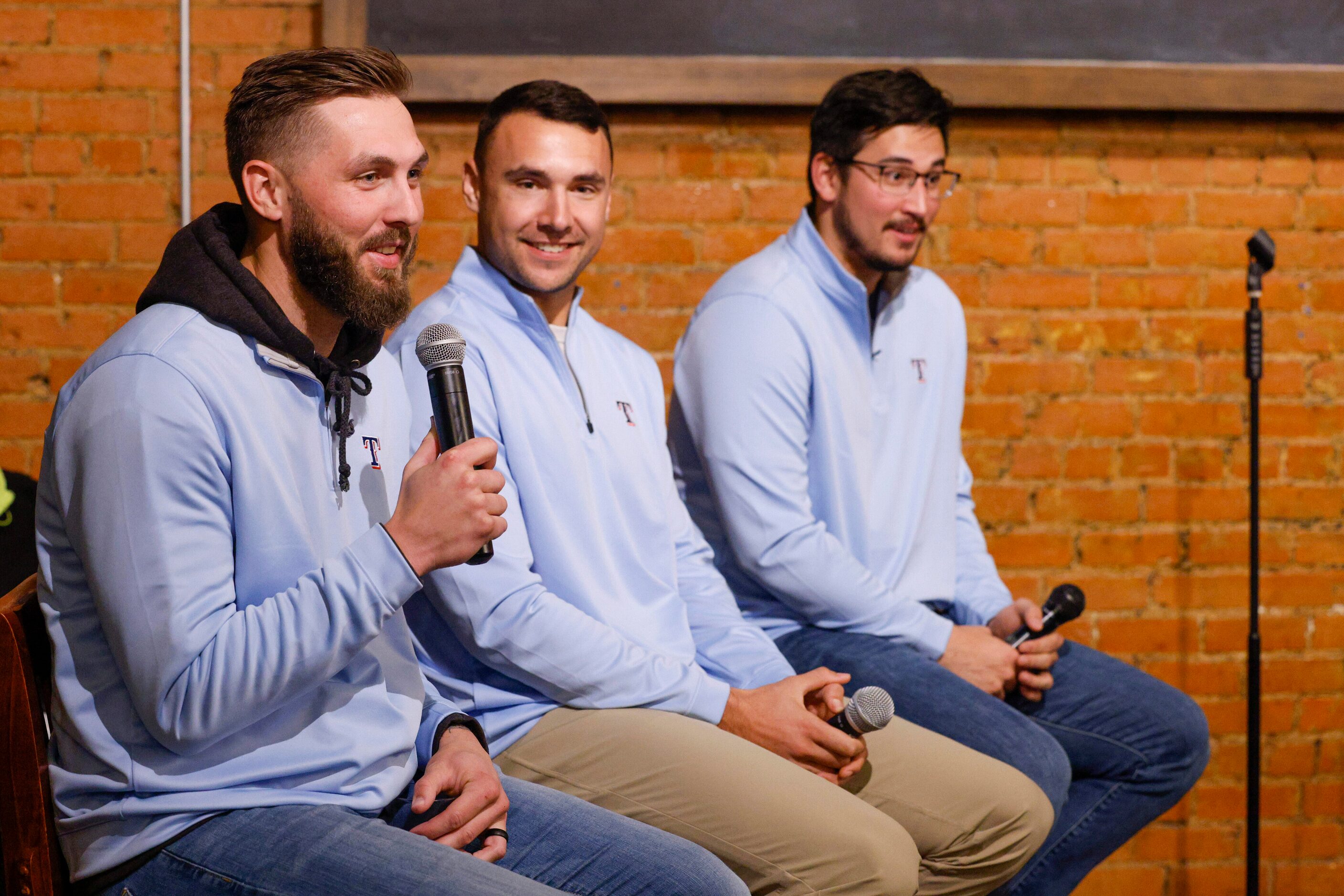 Texas Rangers pitchers Joe Barlow (from left), Brock Burke and Dane Dunning answer questions...