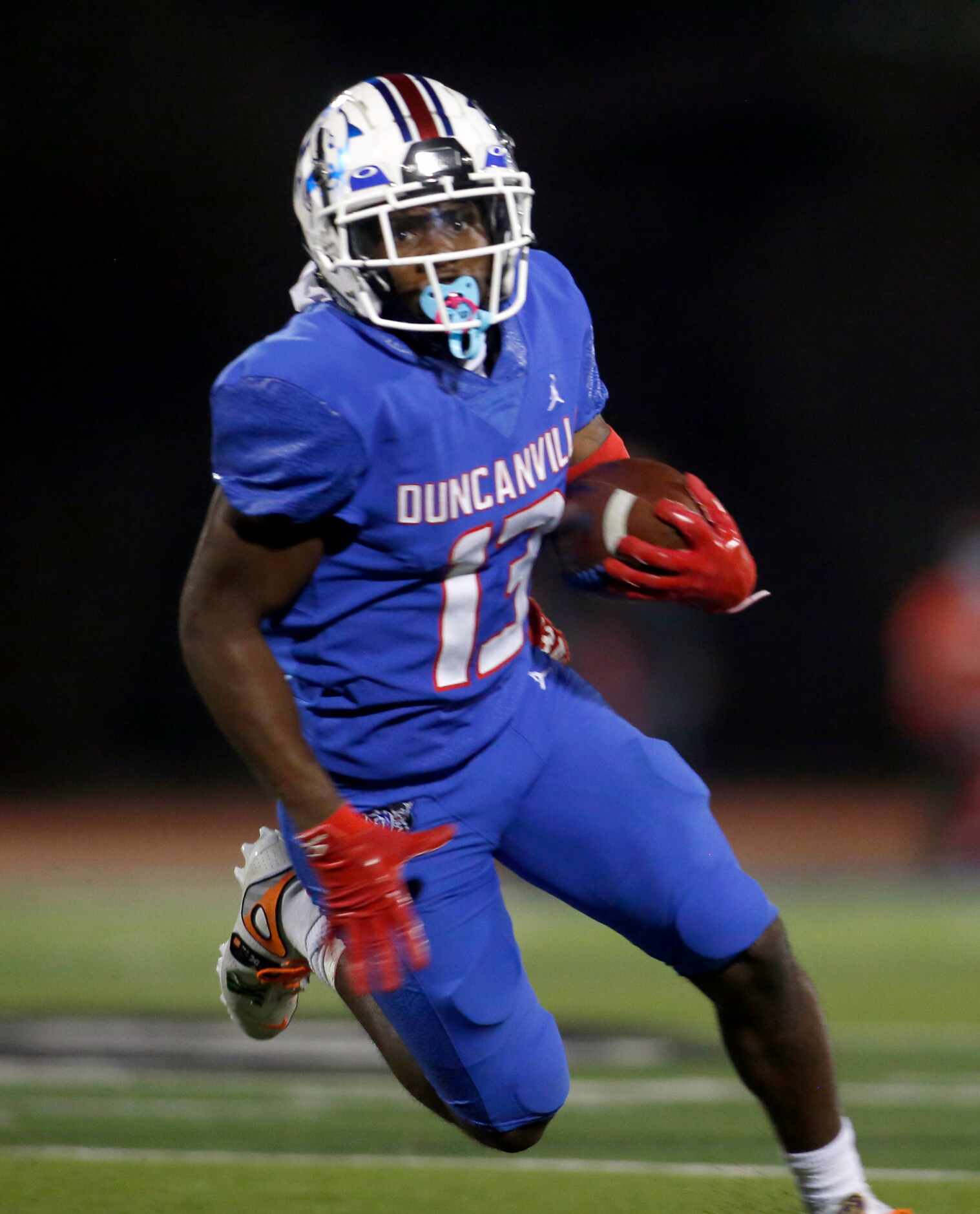 Duncanville receiver Roderick Daniels, Jr, (13) rambles into the end zone for a touchdown to...