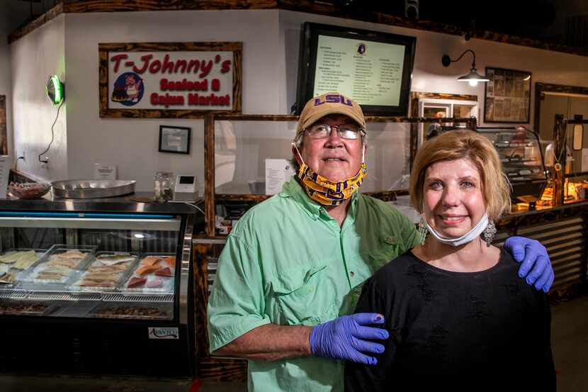 Owners Phil Tullis and Deborah Allen-Tullis pose for a portrait at T-Johnny's Seafood and...
