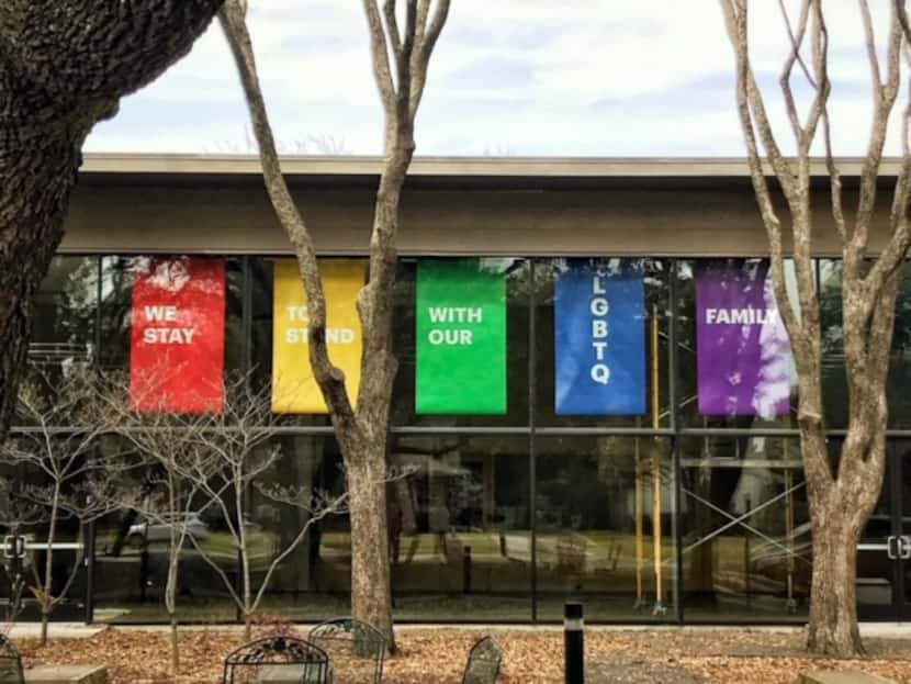 Banners hung at Greenland Hills United Methodist Church in Dallas express support for the...