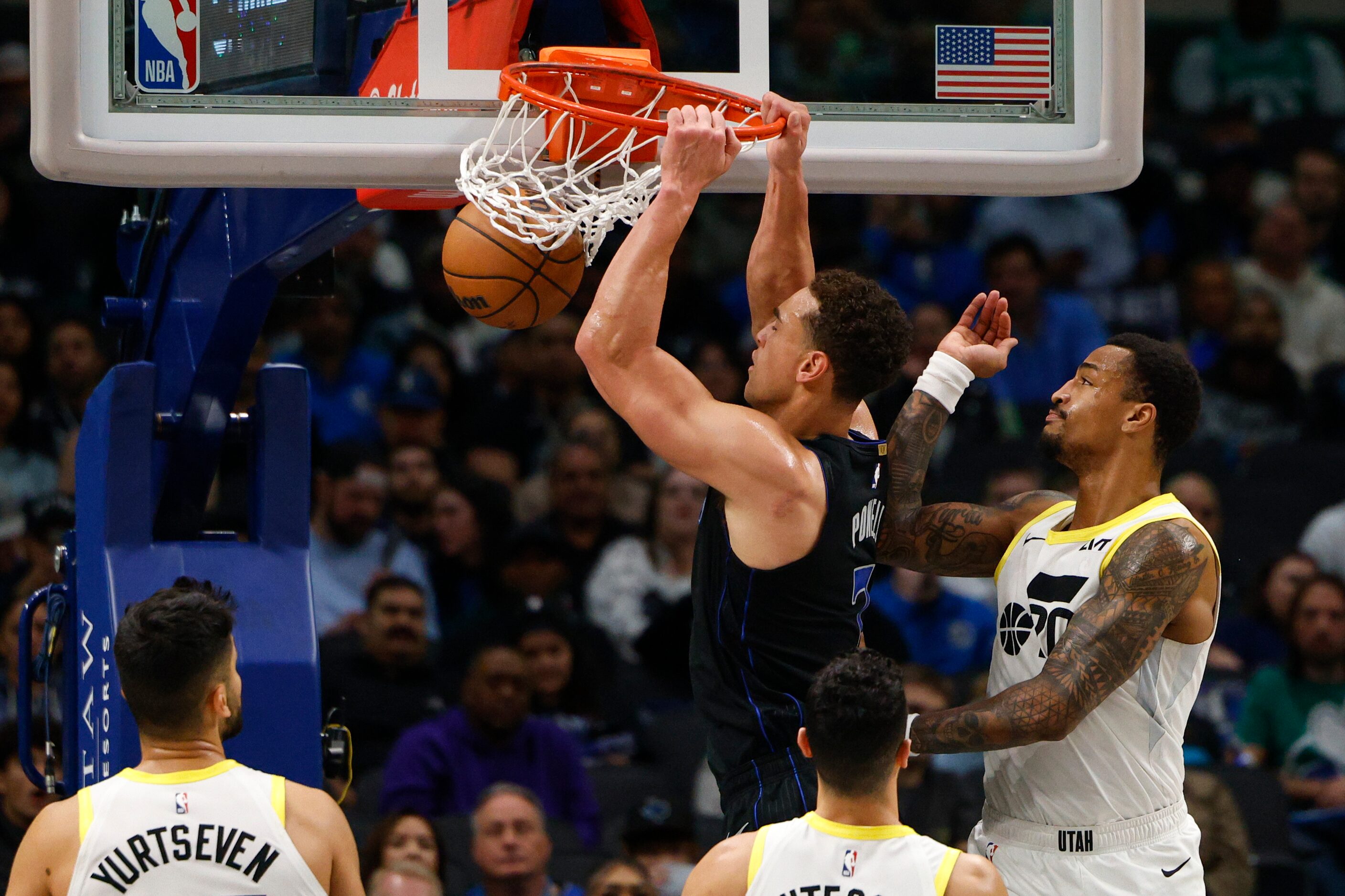 Dallas Mavericks center Dwight Powell (7) dunks the ball during the second half of an NBA...