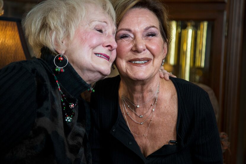 Ann "Auntie" Sanford, left, embraces her sister, Sara Munroe.