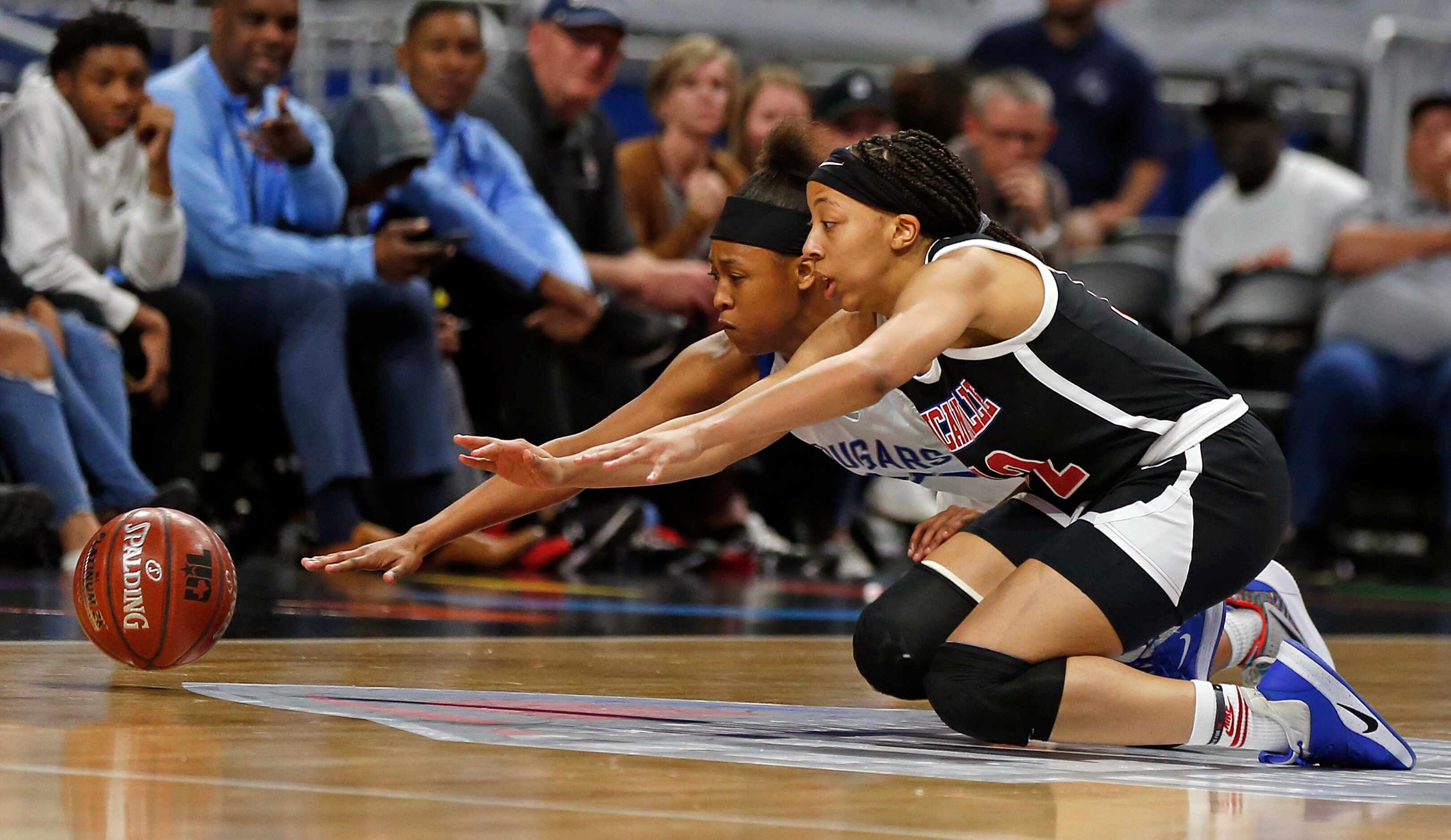 Duncanville center Zaria Rufus #12 dives for a loose ball with Cypress Creek guard Krishawn...