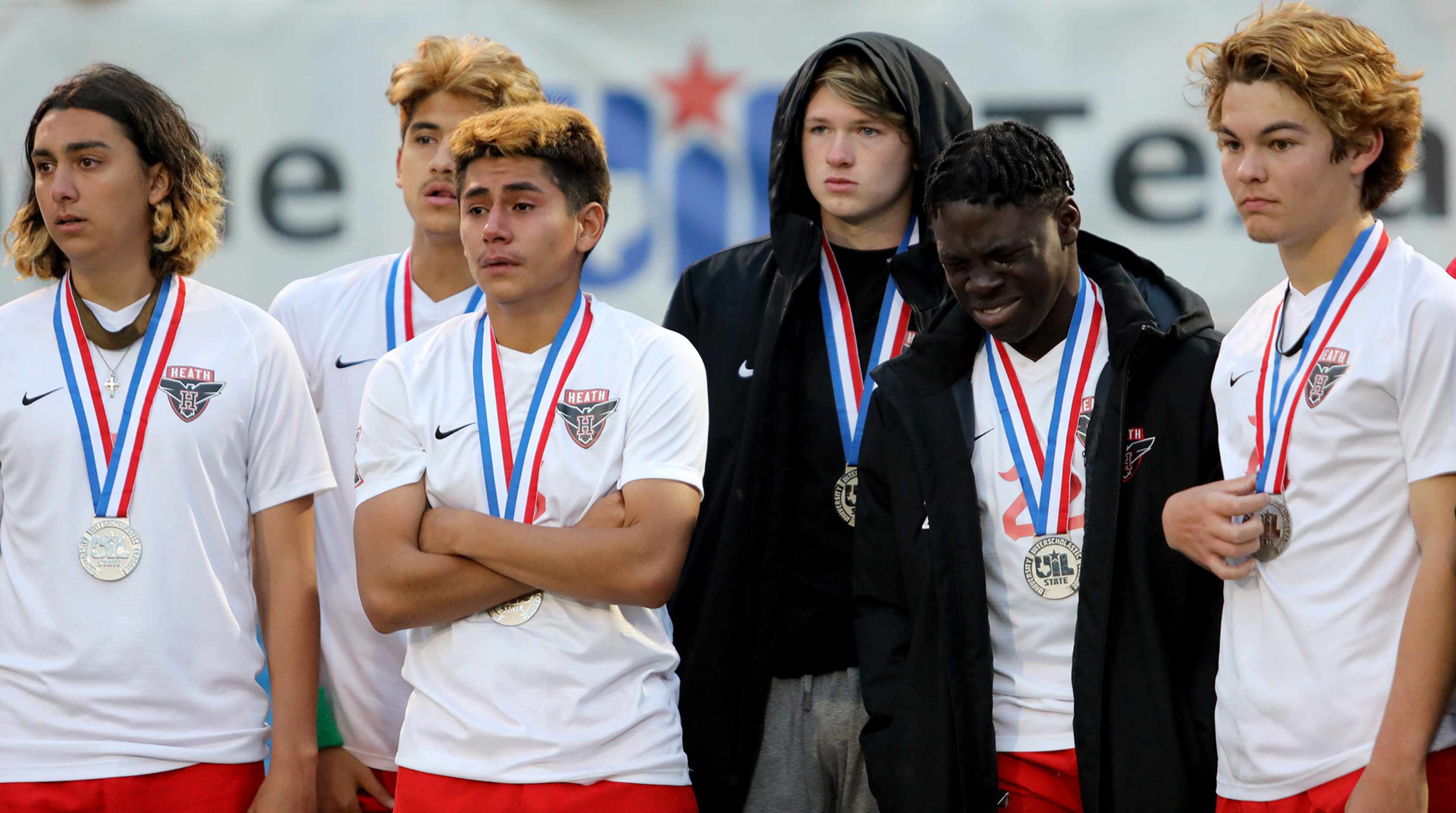 Rockwall-Heath players stand dejected after their UIL 6A boys State championship soccer game...