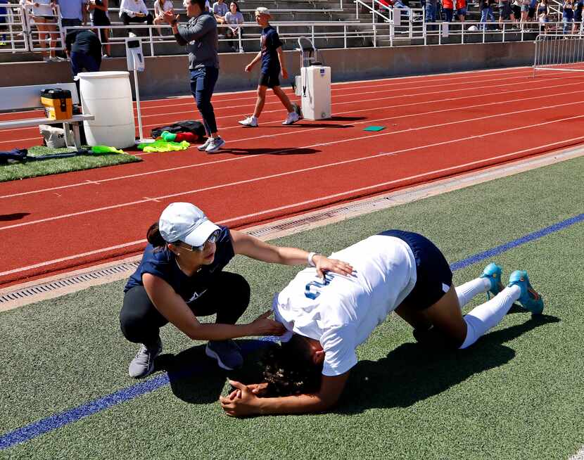 Lone Star defender Daylan Lowe (2) is comforted by a school administrator after loosing in a...