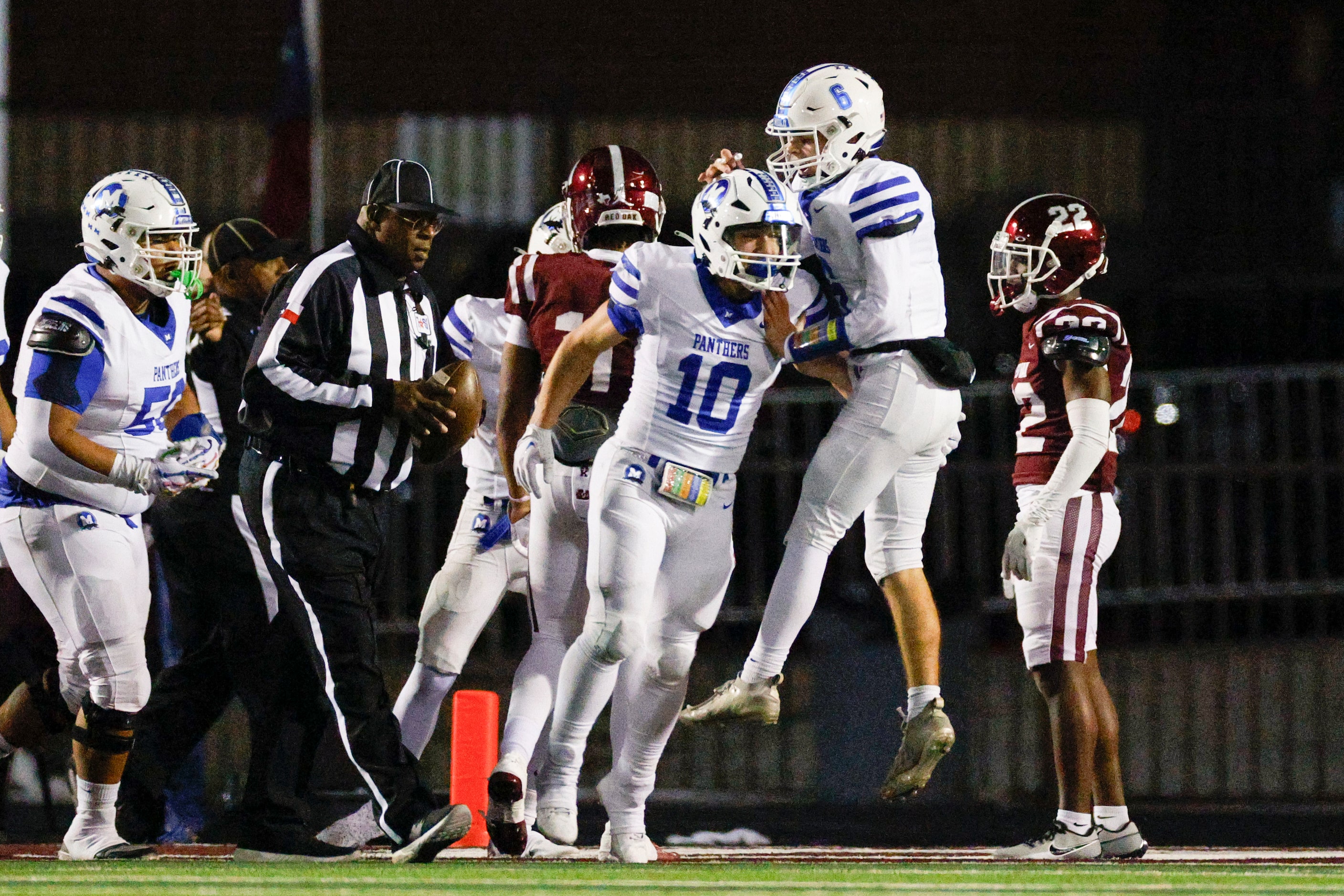 Midlothian running back Michael Garber (10) celebrates his touchdown with quarterback Colin...