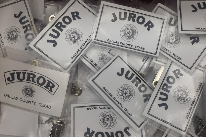 Juror badges sit on the counter in the Central Jury Room of the George Allen Courts Building...