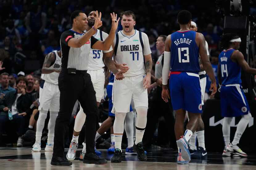 Dallas Mavericks guard Luka Doncic (77) reacts to a foul call during the first half of Game...