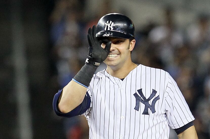 NEW YORK, NY - AUGUST 15:  Nick Swisher #33 of the New York Yankees celebrates his third...