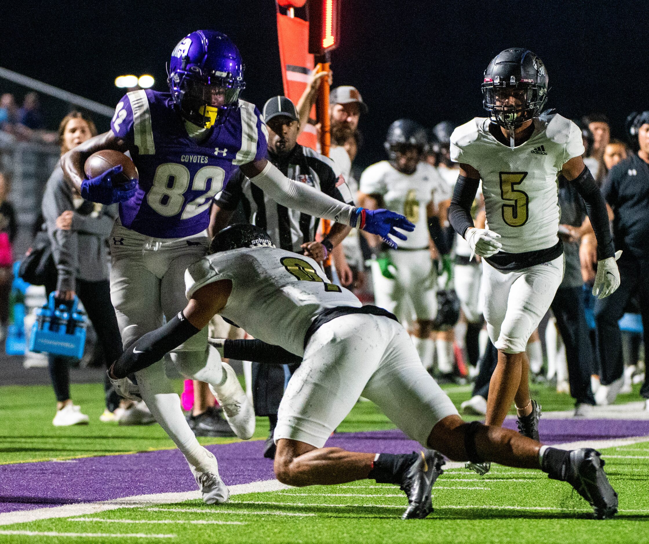 Anna’s Sean Steens (9) is pushed out of bounds by Kaufman’s Dalys Chandler (9) in the first...