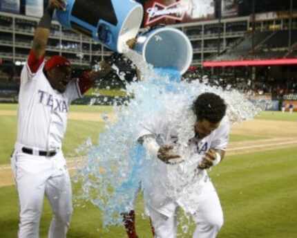  Rangers designated hitter Prince Fielder is doused after a 5-3 victory over the Astros on...