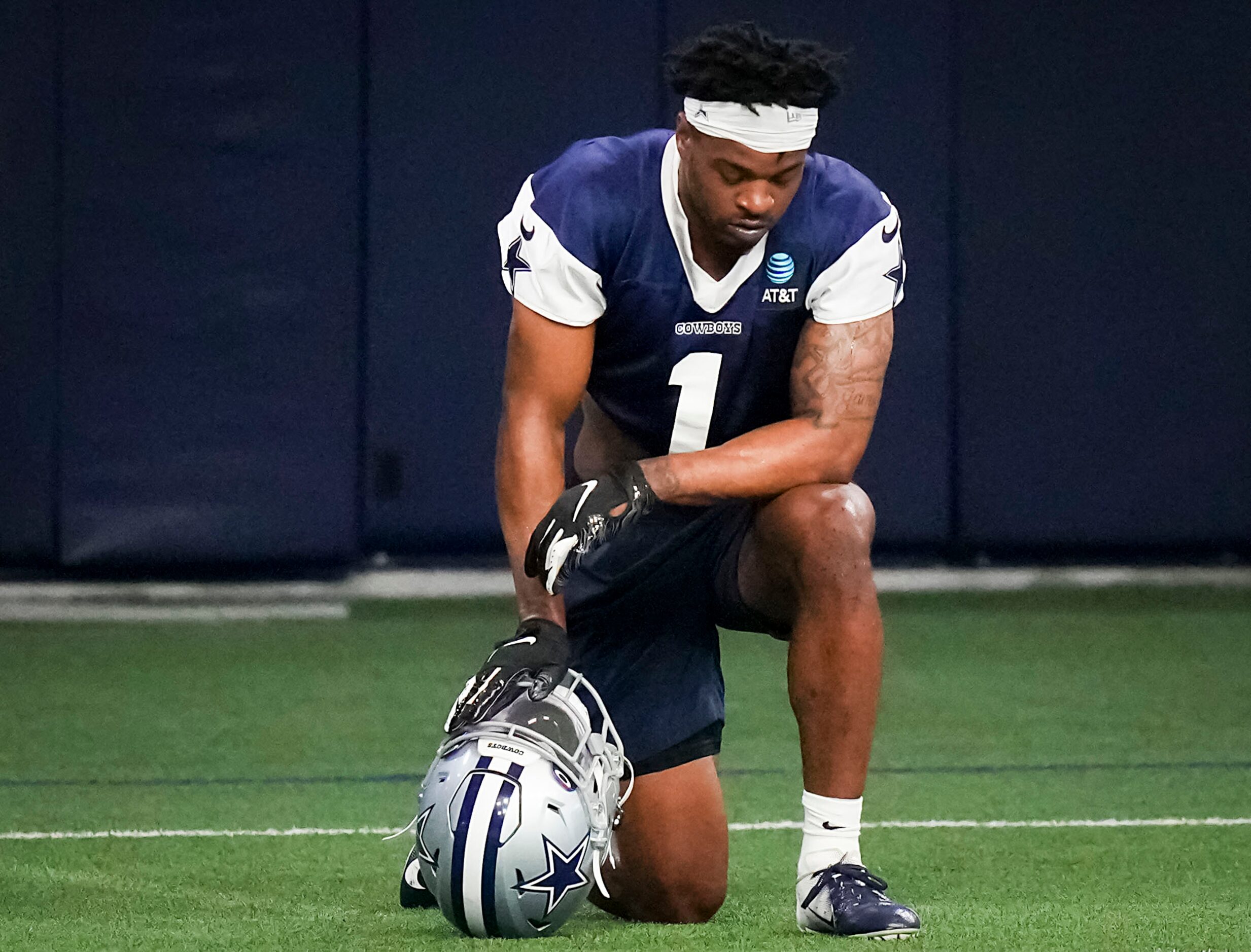 Dallas Cowboys cornerback Kelvin Joseph takes a knee between drills during the OTA team's...