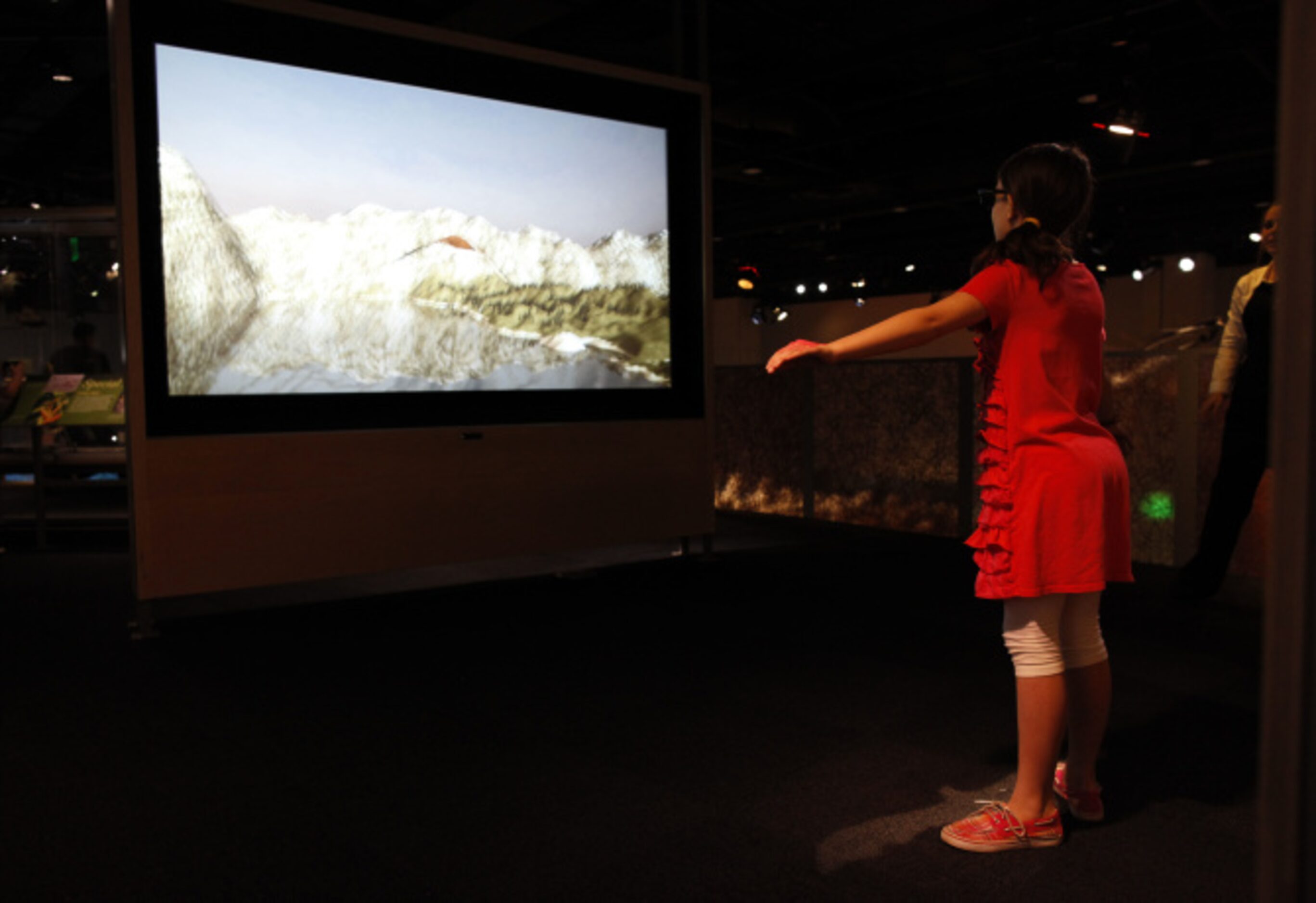 Alyssa Dendle, 10 of Dallas participates in an interactive flying exhibit in the Rose Hall...