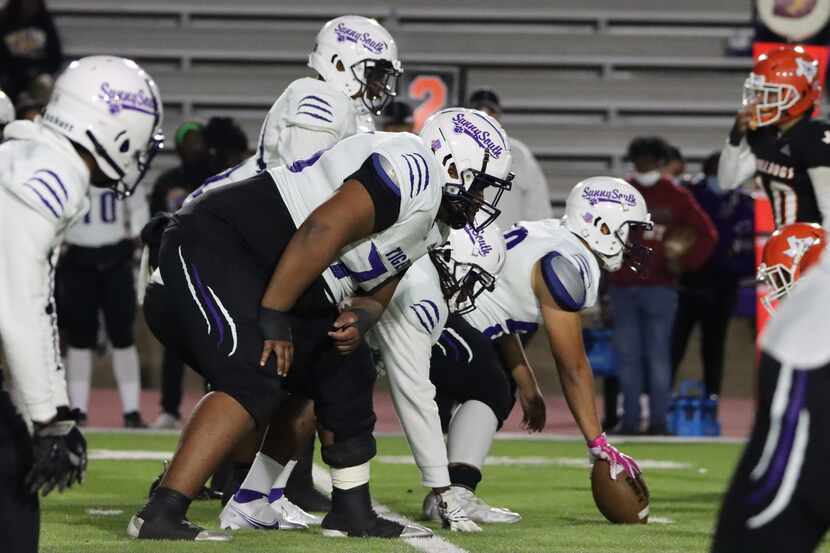 Lincoln offensive guard Jalen Russel (6-foot-4, 400 pounds) gets in his stance before a play...