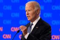 President Joe Biden speaks during a presidential debate hosted by CNN with Republican...