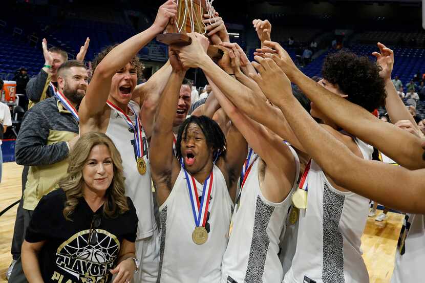 Plano East celebrates with its trophy after defeating Round Rock Stony Point 53-41 in the...