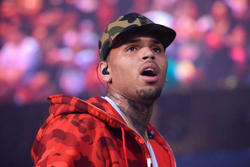 FILE - In this June 7, 2015, file photo, rapper Chris Brown performs at the 2015 Hot 97...