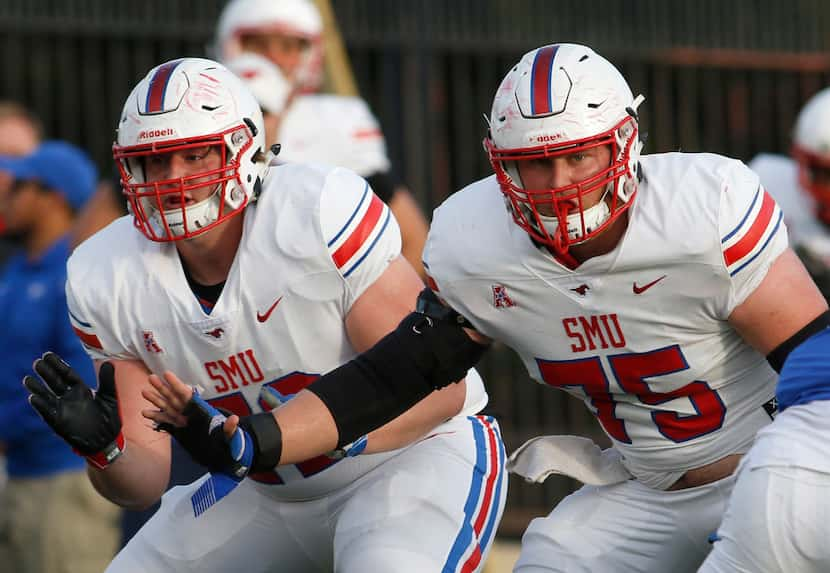 SMU Mustangs offensive linemen Nick Dennis (72) and Hayden Howerton (75) work in tandem to...