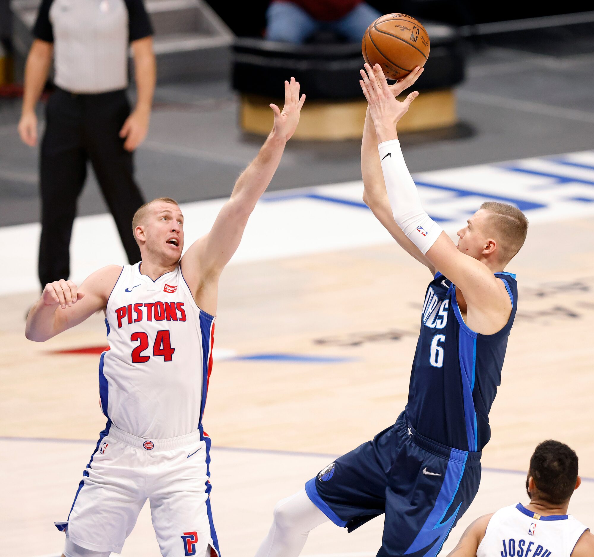 Dallas Mavericks center Kristaps Porzingis (6) puts up a shot over Detroit Pistons center...