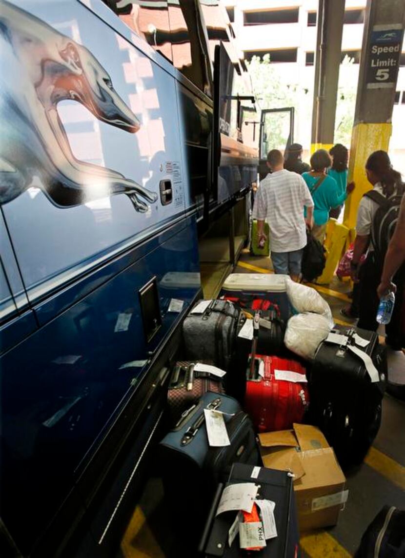 
Passengers line up for boarding. Greyhound has been overhauling its fleet with new engines...