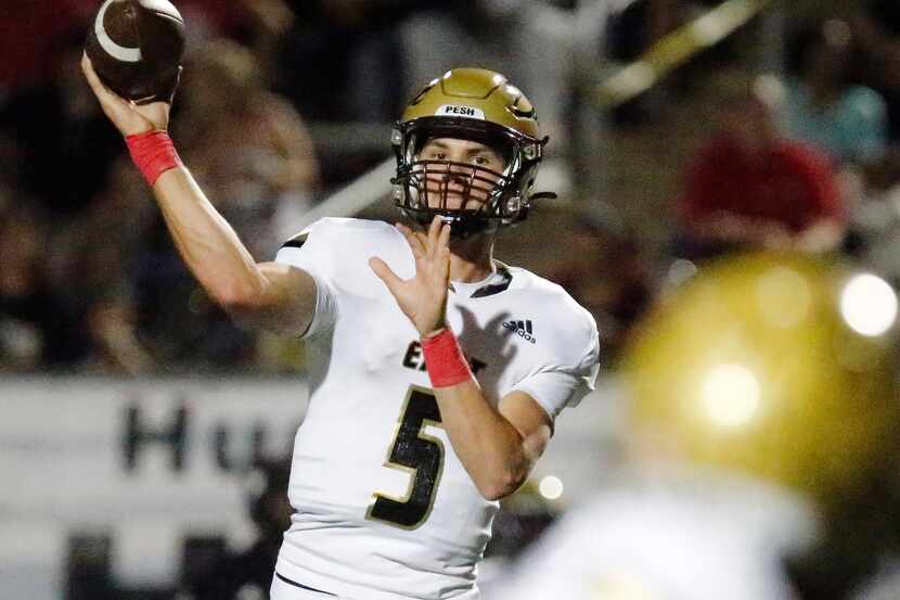 Plano East High School quarterback Drew Devillier (5) during the first half as Plano High...