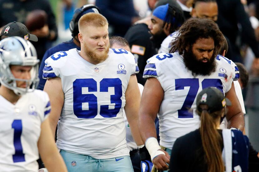 Dallas Cowboys center Tyler Biadasz (63) is pictured on the sideline next to fellow center...
