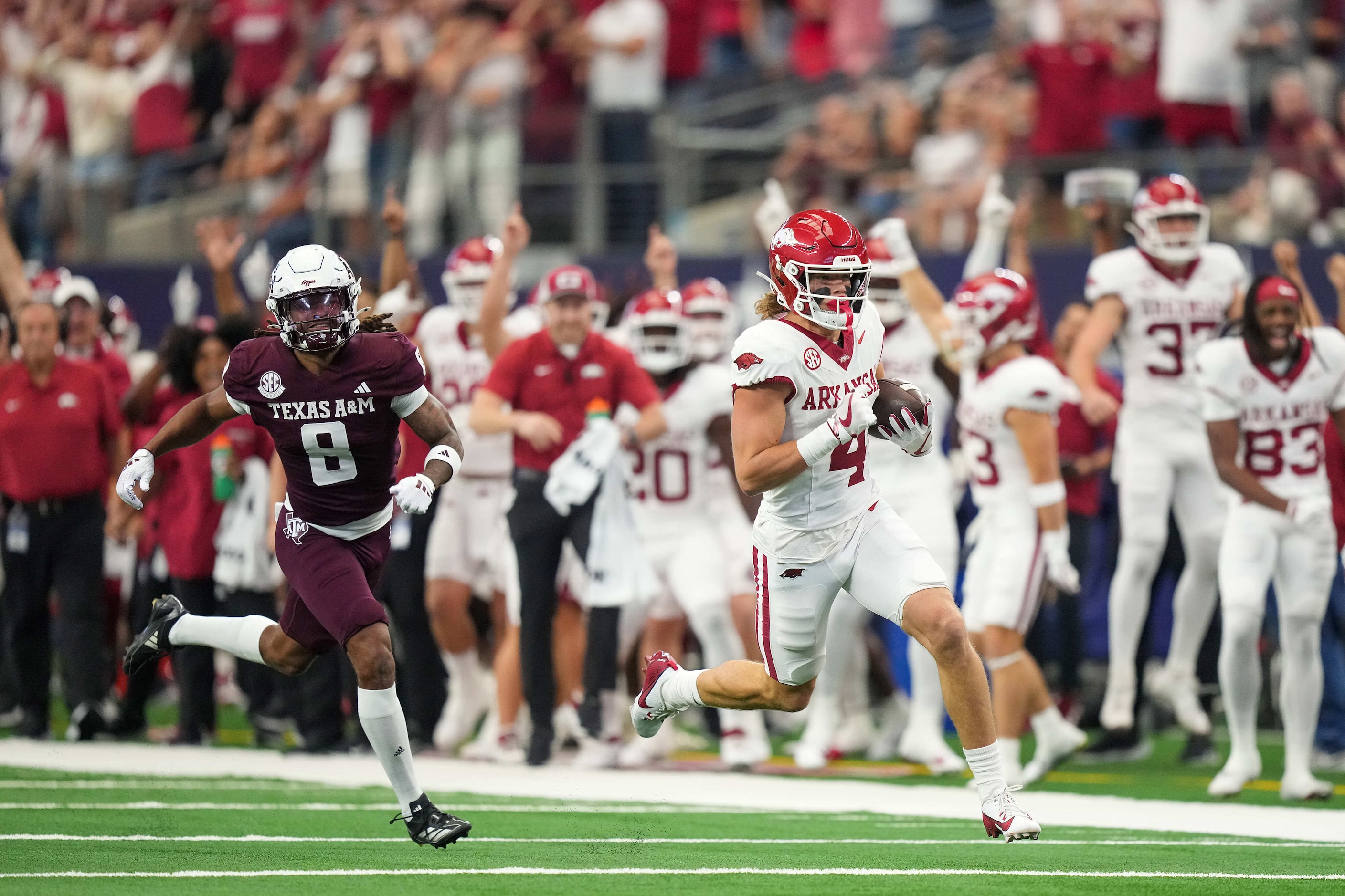 Arkansas wide receiver Isaac TeSlaa (4) gets past Texas A&M defensive back Jaydon Hill (8)...