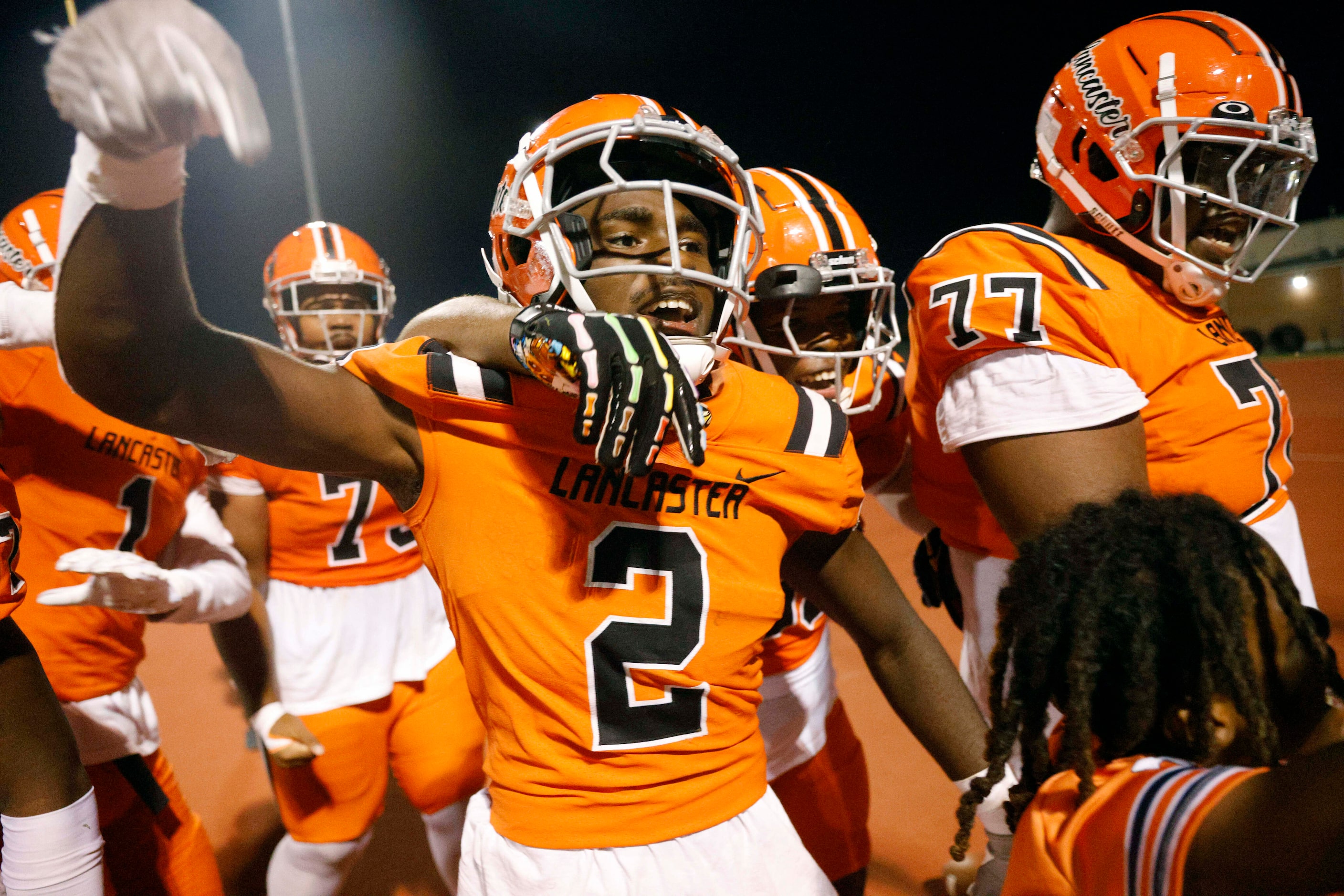 Lancaster running back Izayah Lee (2) celebrates his game-winning touchdown in overtime of a...